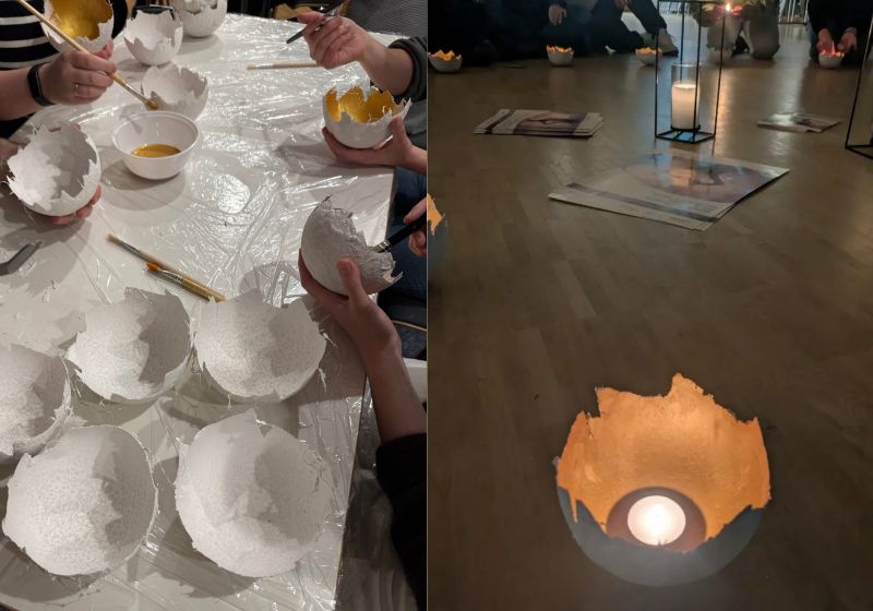 Kerzenschalen aus Gips werden gemeinsam hergestellt und mit Goldfarbe bemalt, ein fertiges Goldlicht leuchtet